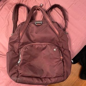 Pacsafe burgundy travel backpack